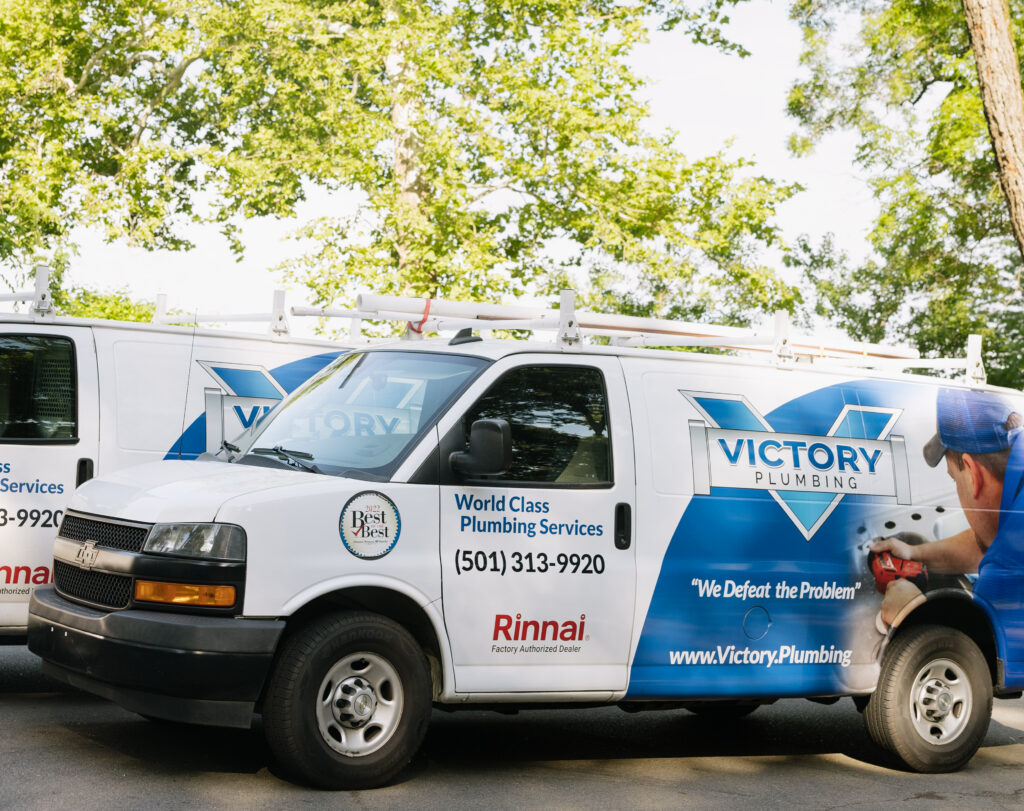 Victory plumbing branded vehicles.
