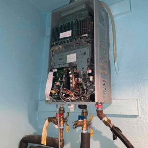 Tankless water heater with front panel removed